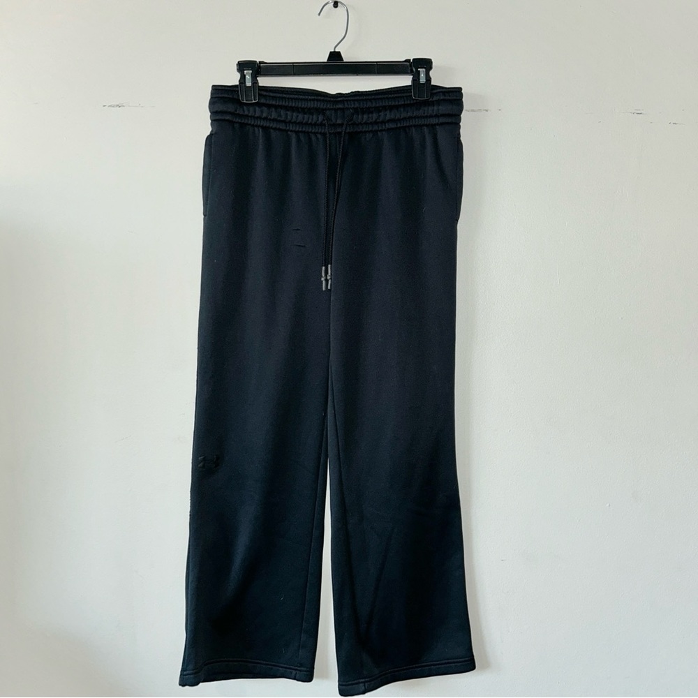 Under Armour large black sweats with pockets. Worn twice. There is a small snag